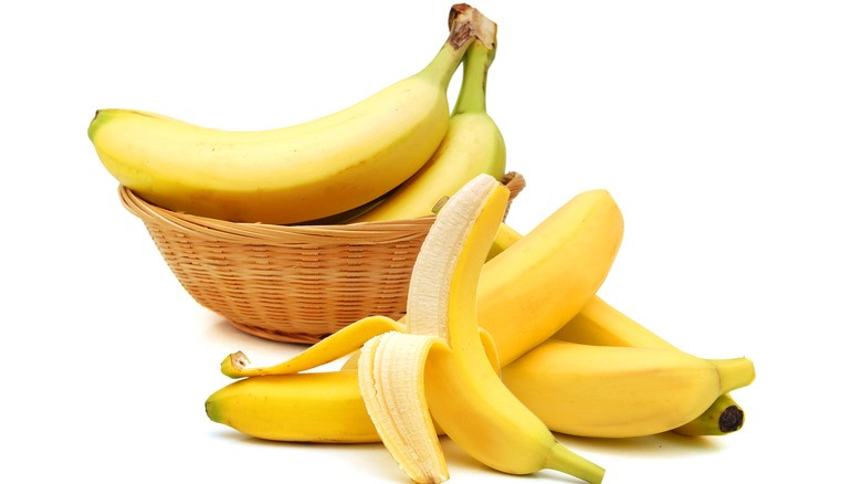 A dynamic image of an athlete holding a banana with a heart-health icon overlay plus a sleep icon. "Banana Benefits: Boosting Heart Health, Energy & Sleep")